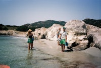 a group of people standing in the water