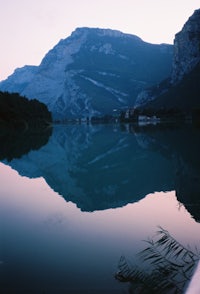a mountain is reflected in the water of a lake