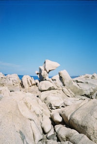 a rock formation on the side of a cliff