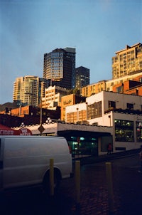 a white van parked in front of a building