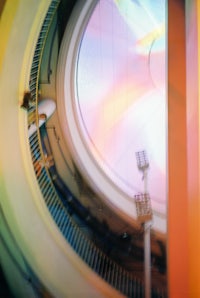 an image of a circular building with colorful lights