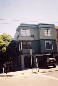 a car is parked in front of a building