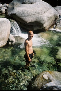 a man standing in a stream