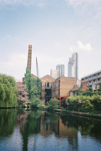 a city is reflected in a body of water