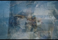 a group of people standing in front of a window