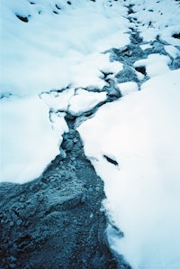 a stream in the snow