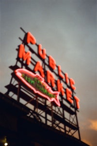 a public market sign on the side of a building