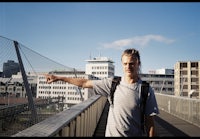 a man on a skateboard on a bridge